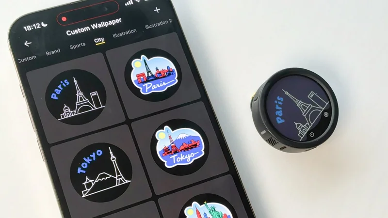 Smartphone showing custom city wallpapers, including Paris and Tokyo icons, beside a small round gadget displaying a Paris skyline illustration on its circular screen.