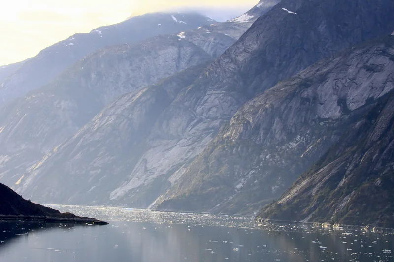 Image of a narrow strait surrounded by tall mountains.