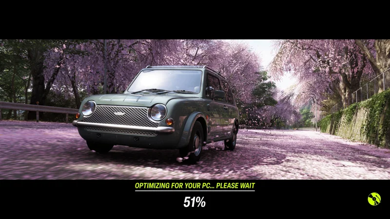 A vintage car drives through cherry blossom petals with the on-screen text 'OPTIMIZING FOR YOUR PC... PLEASE WAIT 51%'.