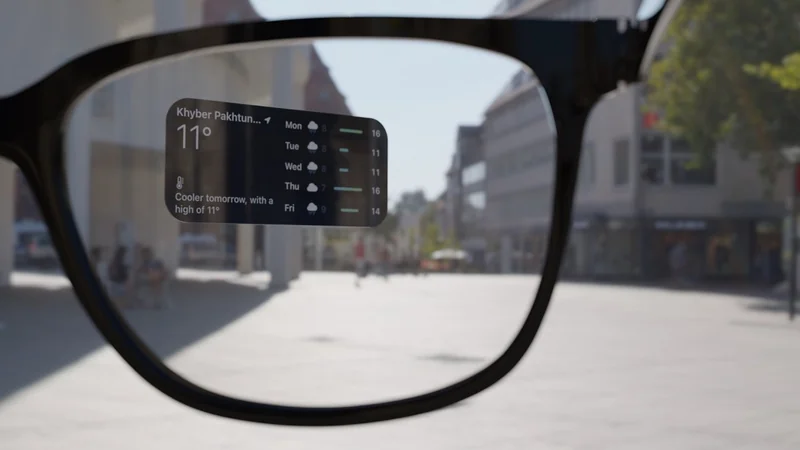 Smart glasses lens showing transparent weather forecast display while looking down a bright city street with buildings, pedestrians, and trees in the background