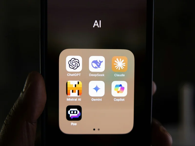 AI apps including Claude on a mobile smartphone as Anthropic's IPO filing marks the maturation of generative AI from a research-heavy venture phase into a stabilised enterprise utility.