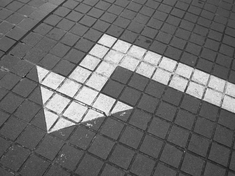 Arrow on the floor as AI investments by insurers are now expected to generate tangible business value beyond mere efficiency, requiring a change in strategy.