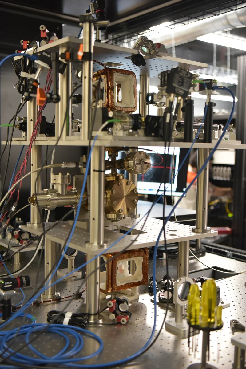 Image of a complicated set of wires, structural elements, and lenses.