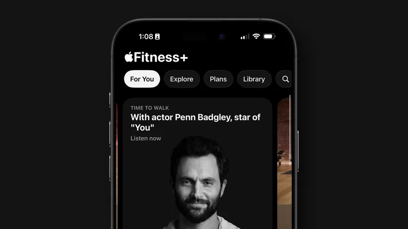 iPhone screen showing Apple Fitness Plus app, highlighting a Time to Walk audio session featuring actor Penn Badgley, with navigation tabs For You, Explore, Plans, Library at top