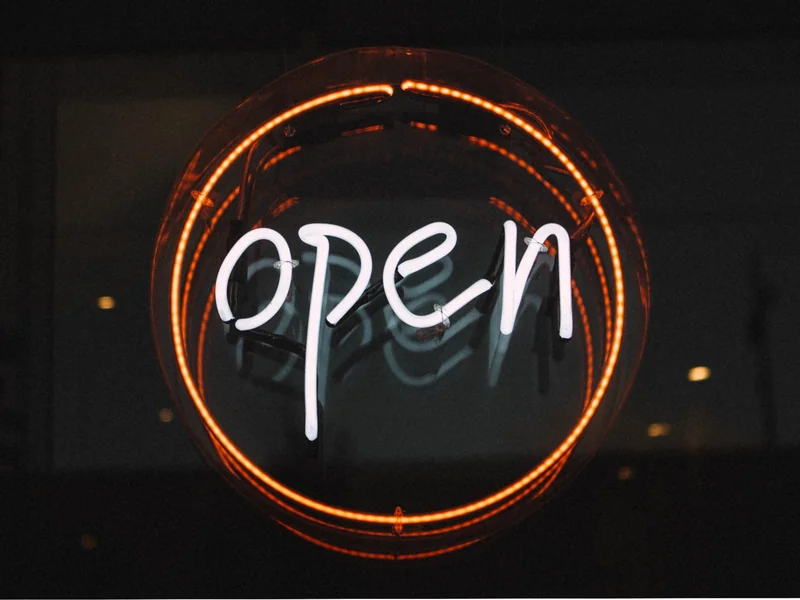 Open store sign as optimising retail AI infrastructure drives the successful deployment of personalisation systems and real-time customer insight.