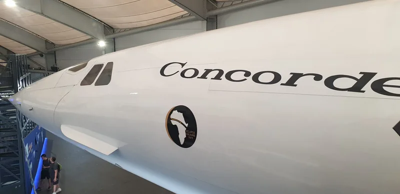 Image of the side of an aircraft with a circular logo including the shape of Africa.
