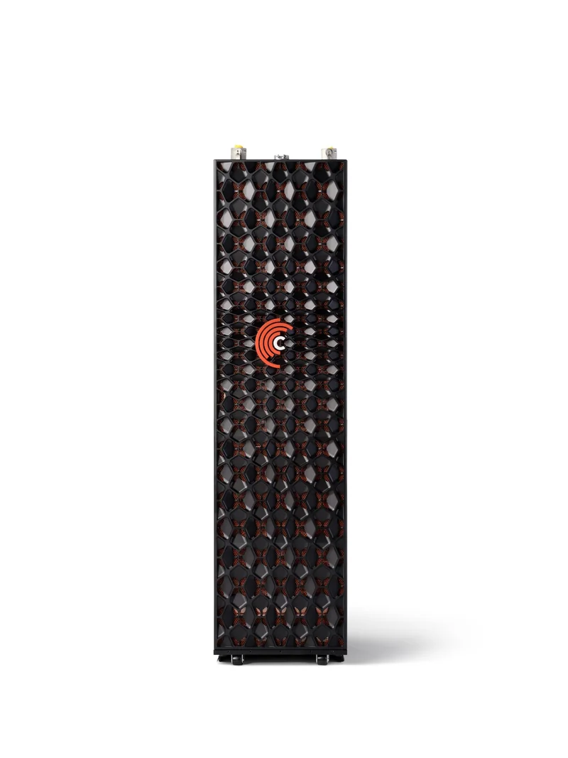 A vertical data storage tower with a patterned front grill and a logo featuring an orange spiral design.