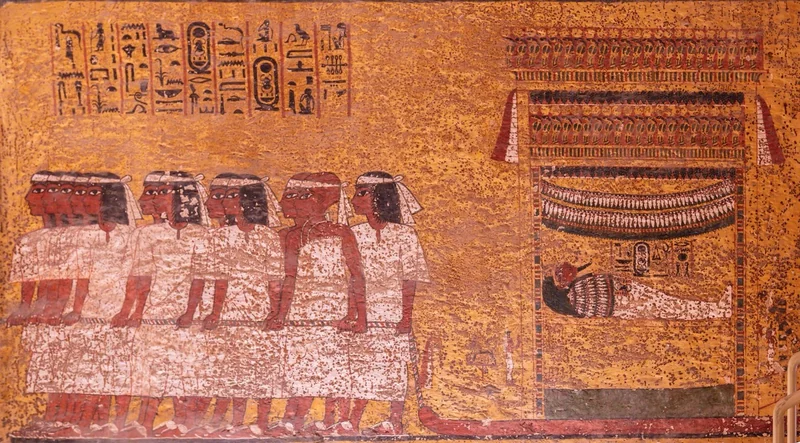 The east wall of the burial chamber, showing court officials dragging Tutankhamun's mummy to his tomb