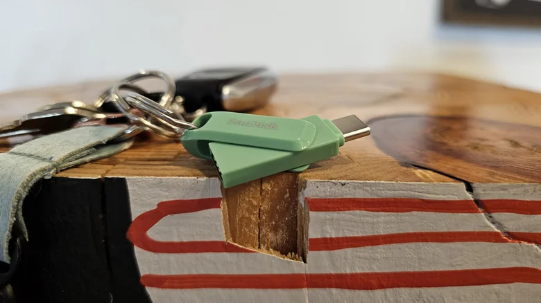 A SanDisk flash drive on a keychain.