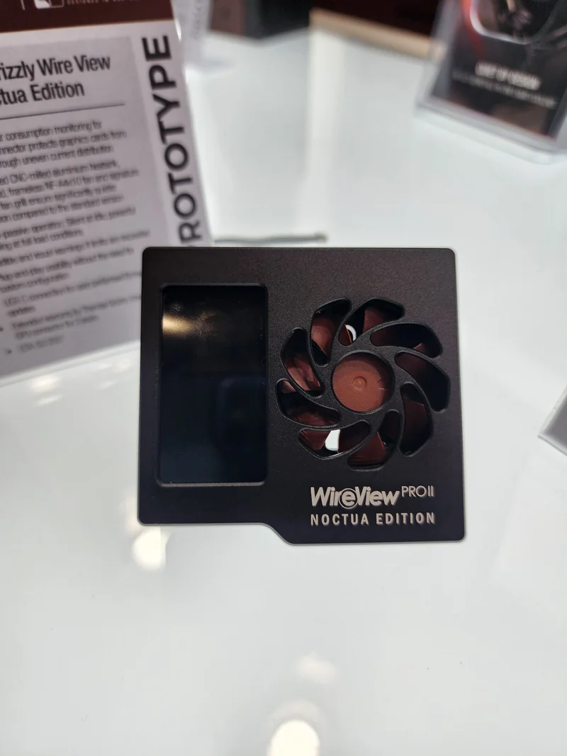 A WireView PRO II Noctua Edition prototype with an integrated fan and display is shown on a reflective surface.