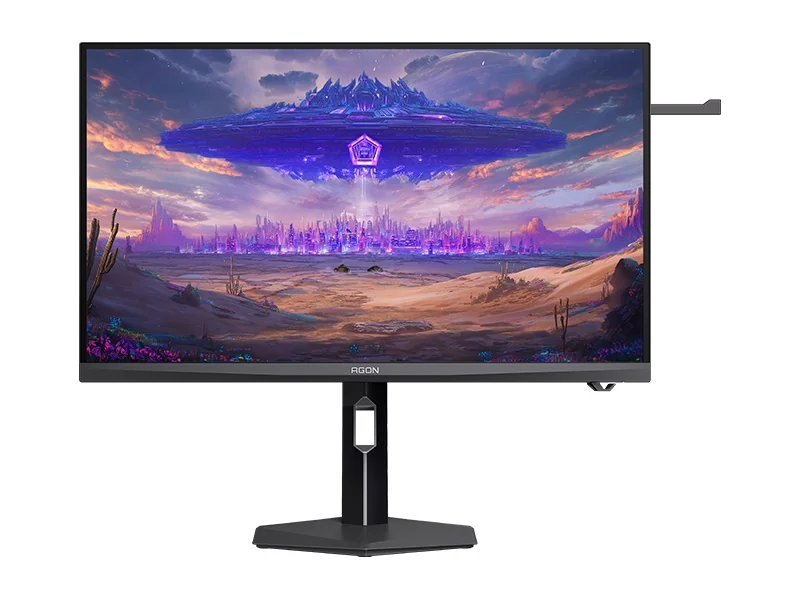 AOC Agon monitor displaying a vibrant science fiction landscape with an alien spaceship hovering over a futuristic cityscape.