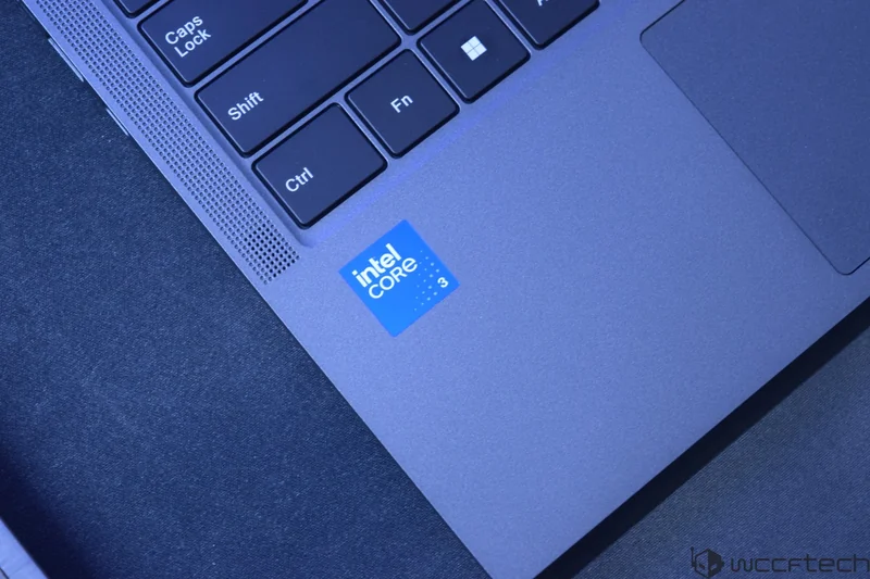 Close-up of a laptop with the 'Intel Core i3' sticker next to the keyboard.