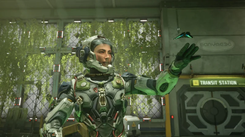 A character in a futuristic spacesuit interacts with a small drone inside a 'Transit Station' labeled area in a sci-fi video game scene.