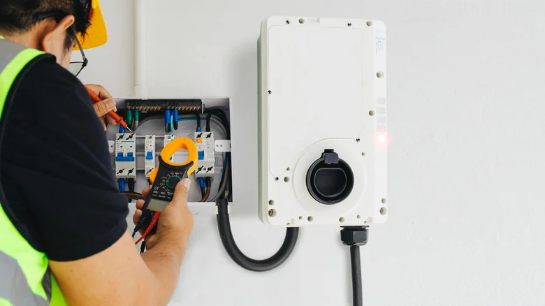 Electrician installing an EV charger