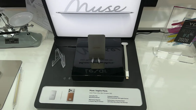 A Lexar Muse Ultra-Slim Portable SSD is displayed on a stand with promotional text highlighting its thin design and compatibility with Apple devices.
