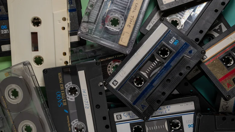 A stash of cassette tapes in a pile.