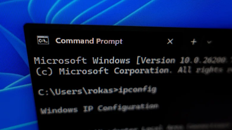 The Windows Command Prompt showing an "ipconfig" command being run.