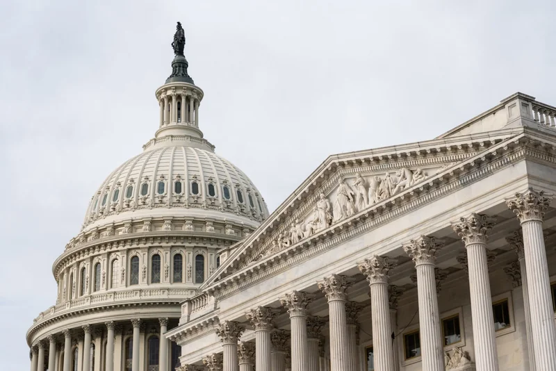 Exterior view of the US Capitol building, including its dome.