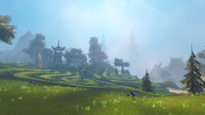 A serene landscape from the game 'World of Warcraft' shows a lush, green field with purple birds and a distant view of towers and fog-covered hills.