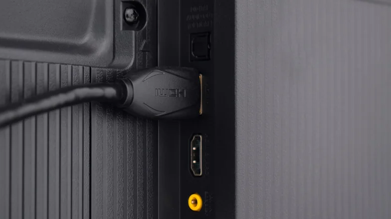 Photo of an HDMI cable plugged into back of a TV.